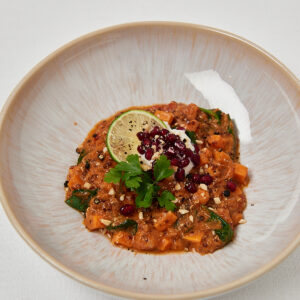 peanut butte lentil stew on white plate