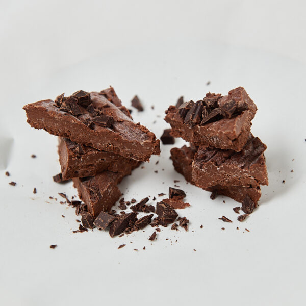 Healthy chocolate fudge pieces on parchment paper, macro-friendly dessert
