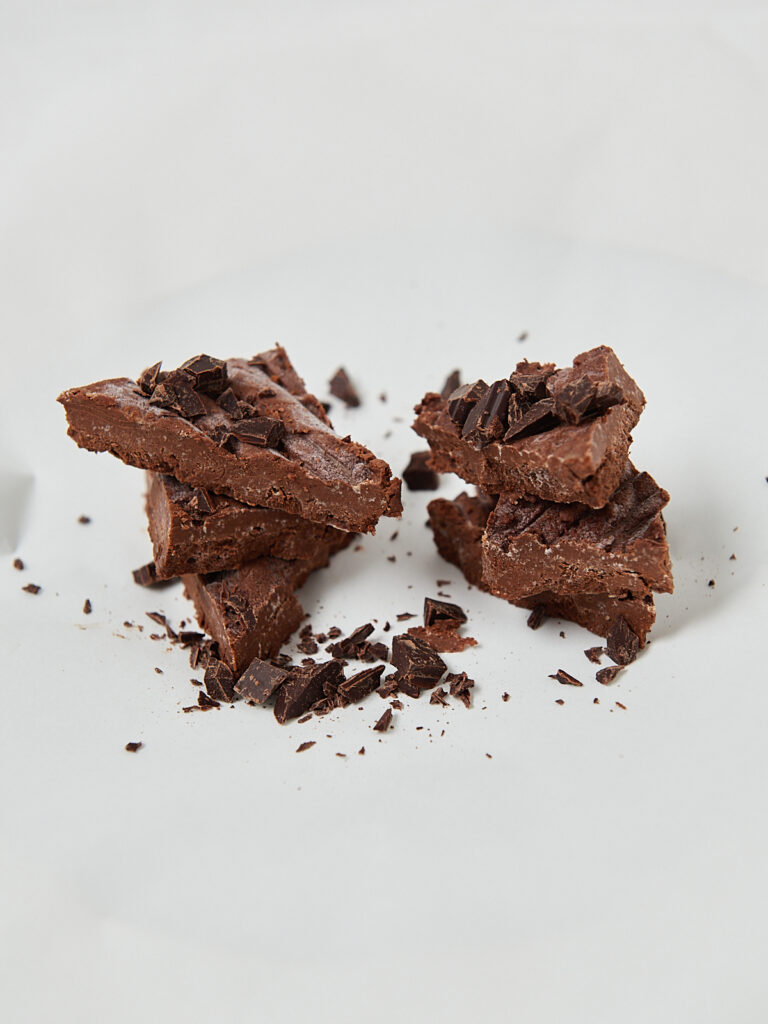 Healthy chocolate fudge pieces on parchment paper, macro-friendly dessert