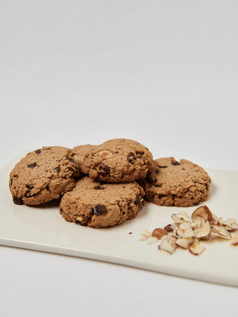 Minimalist food photography of healthy homemade cookies on white plate