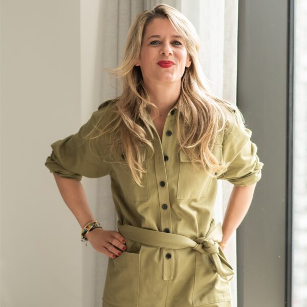 woman standing in a jumpsuit