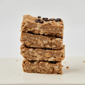 Stacked homemade oat protein bars with chocolate chips