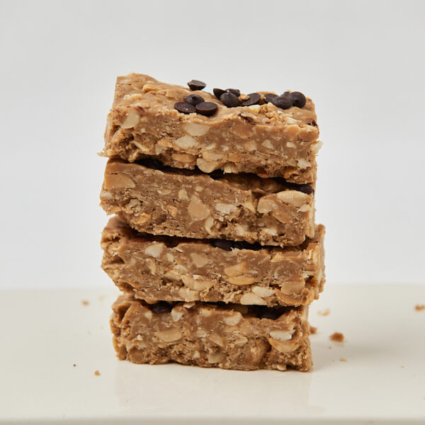 Stacked homemade oat protein bars with chocolate chips