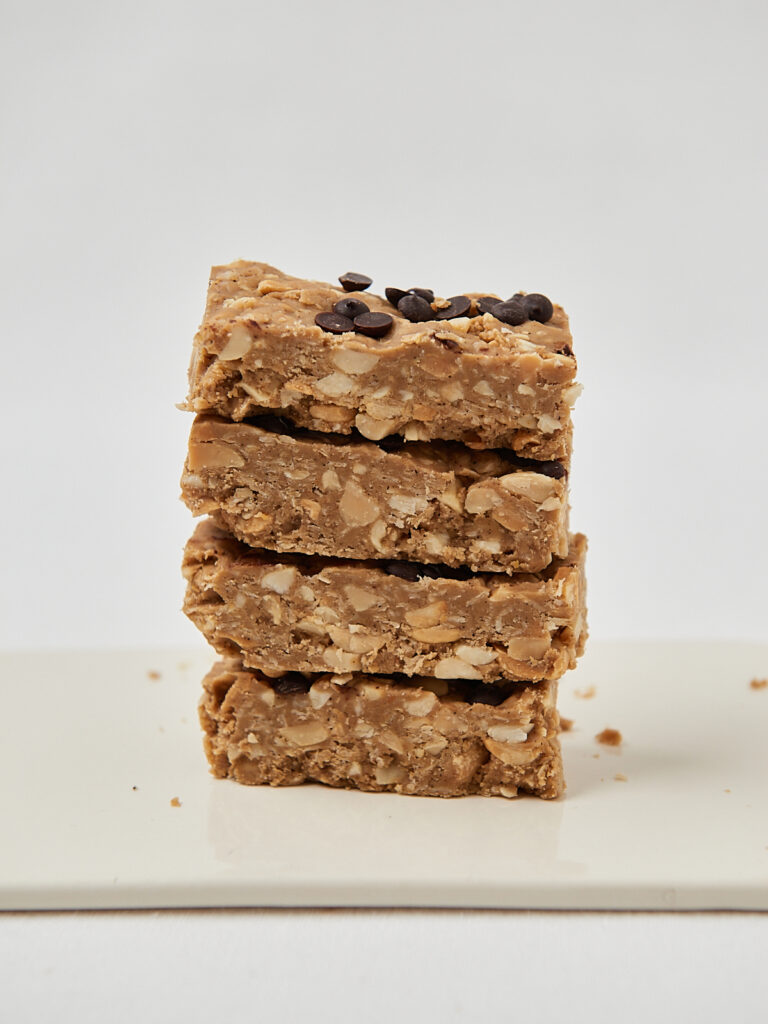 Stacked homemade oat protein bars with chocolate chips