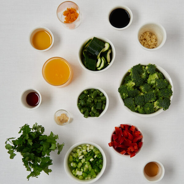 Flatlay of fresh ingredients for veggie stir fry and grain bowl